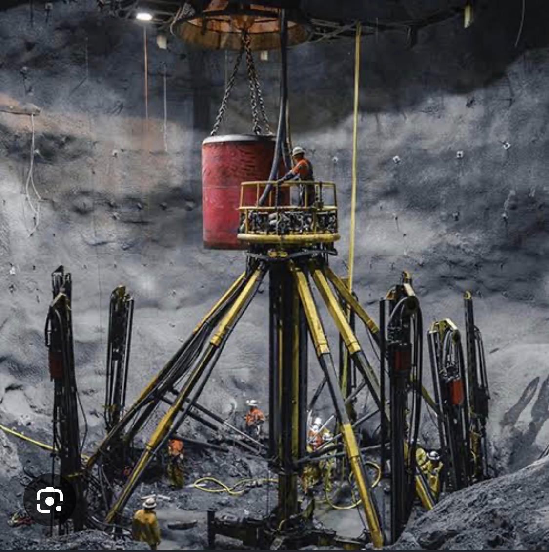 Underground mine shaft with industrial headgear